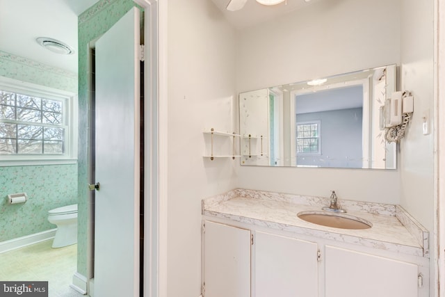 bathroom featuring vanity and toilet