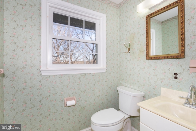 bathroom featuring vanity and toilet