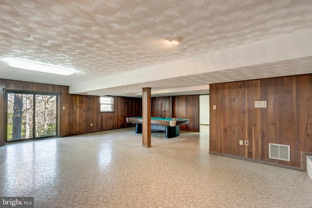 basement featuring wooden walls and pool table