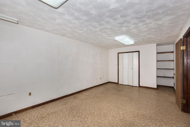 unfurnished bedroom with a textured ceiling