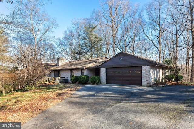 single story home with a garage