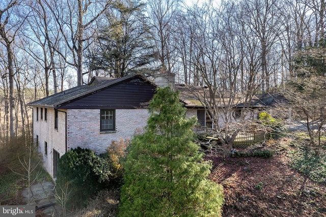 view of side of property featuring a deck