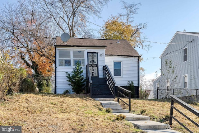 view of front of home with a front lawn