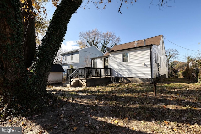 rear view of house featuring a deck