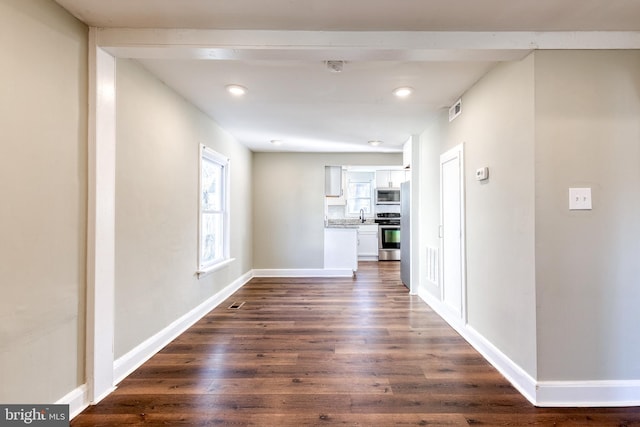 hallway featuring dark hardwood / wood-style flooring and sink