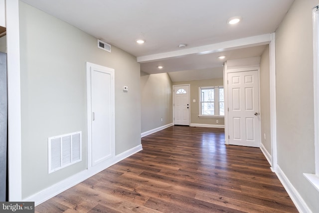 foyer with dark hardwood / wood-style flooring