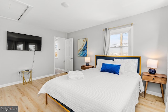 bedroom with light wood-type flooring