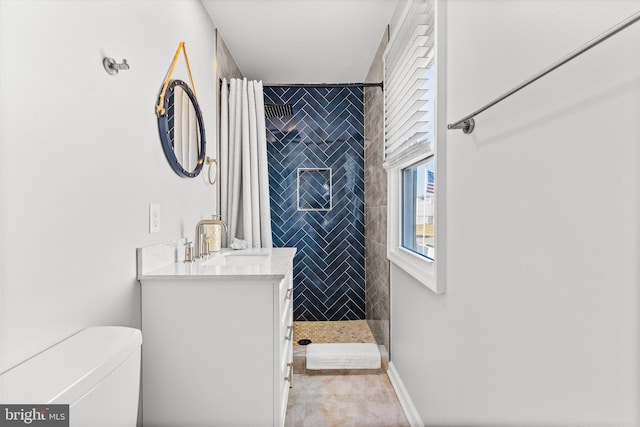 bathroom with a shower with shower curtain, vanity, toilet, and tile patterned flooring