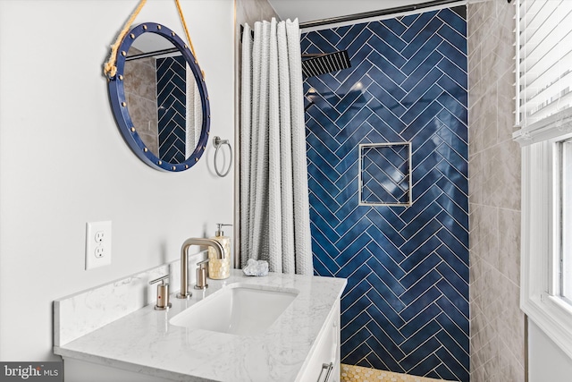 bathroom with plenty of natural light and vanity