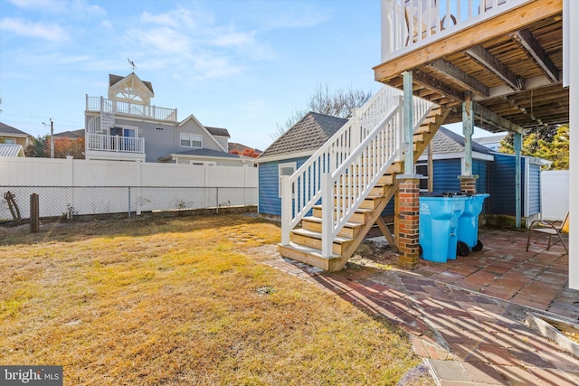 view of yard with a patio and a wooden deck