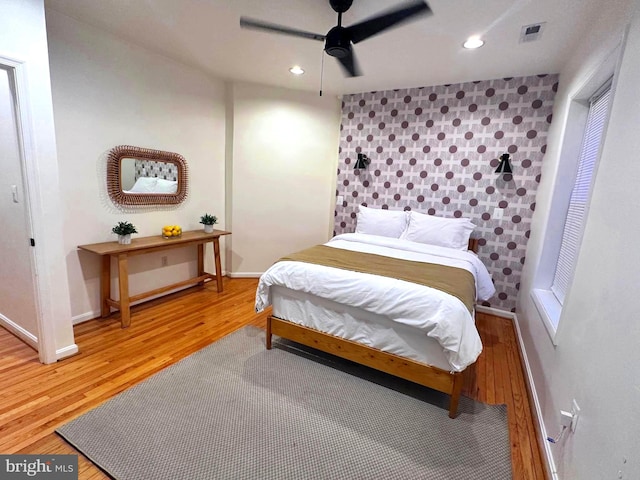 bedroom featuring ceiling fan and hardwood / wood-style floors