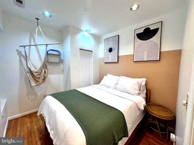 bedroom featuring dark hardwood / wood-style flooring