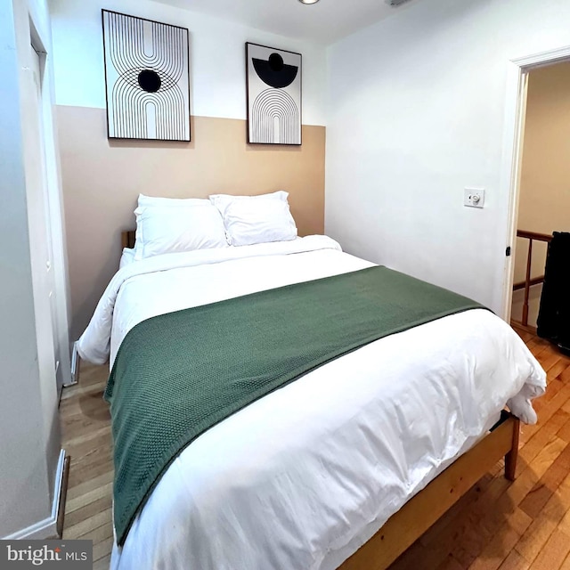 bedroom featuring hardwood / wood-style flooring