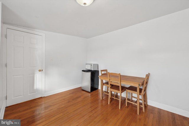 dining area featuring hardwood / wood-style floors