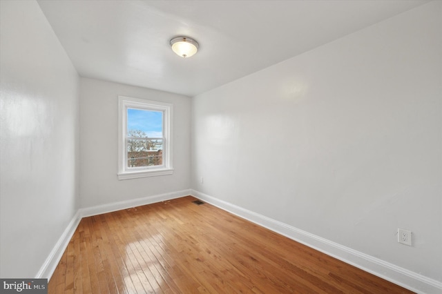 spare room featuring hardwood / wood-style flooring