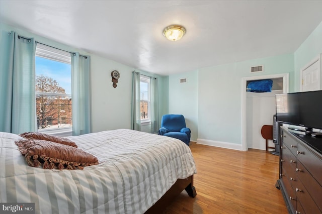 bedroom featuring light wood-type flooring