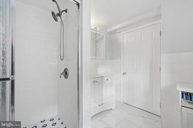 bathroom with a tile shower