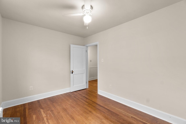 empty room featuring hardwood / wood-style floors and ceiling fan