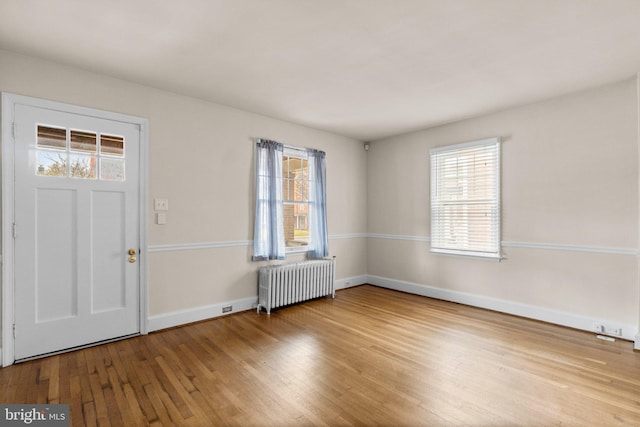 entryway featuring light hardwood / wood-style floors and radiator