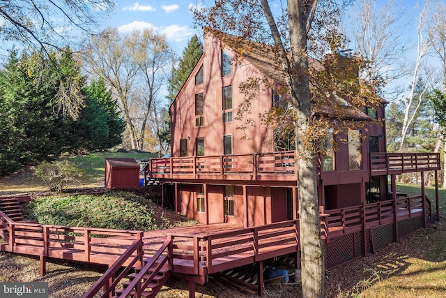 back of property featuring a deck