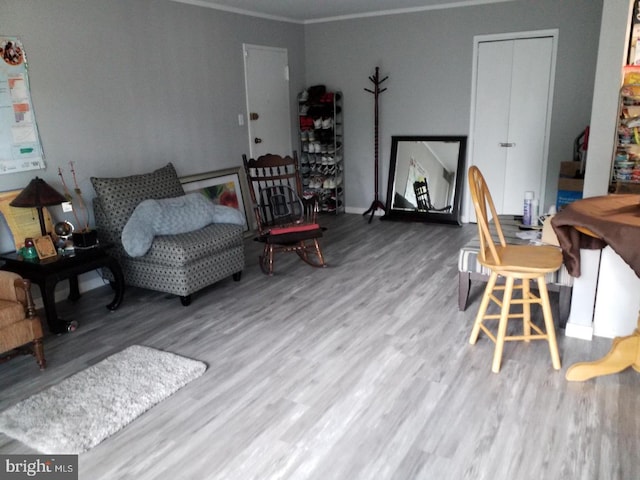 interior space with crown molding and hardwood / wood-style flooring