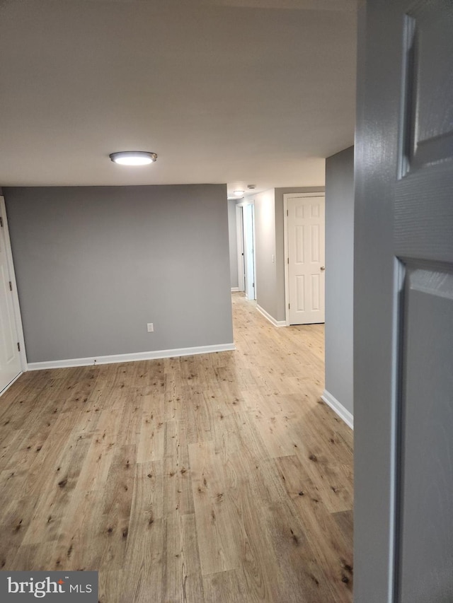 spare room featuring light wood-type flooring