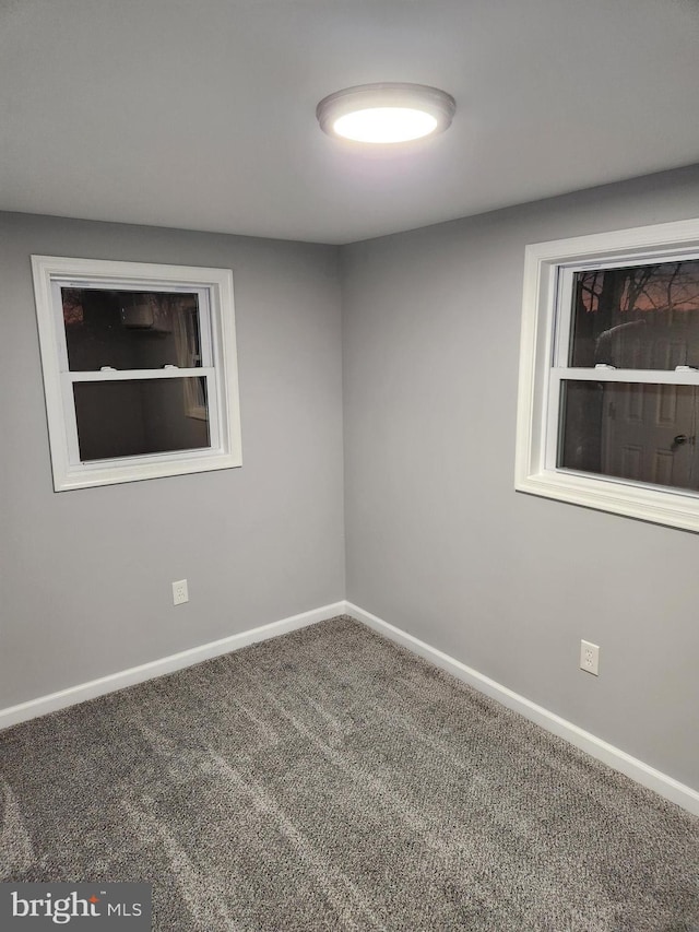 unfurnished room with carpet floors