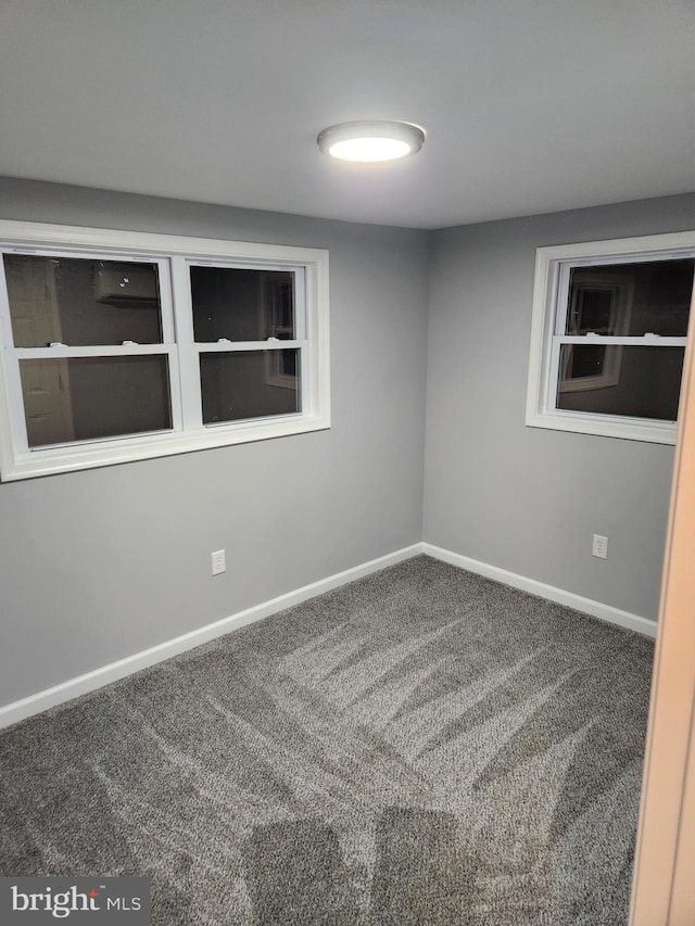 unfurnished room featuring carpet flooring