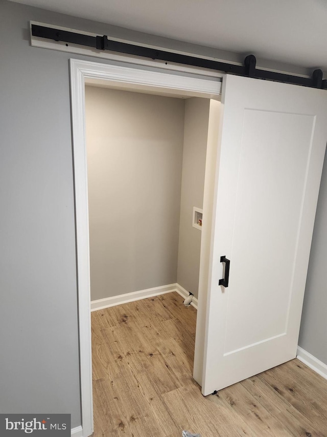 washroom featuring washer hookup and light wood-type flooring