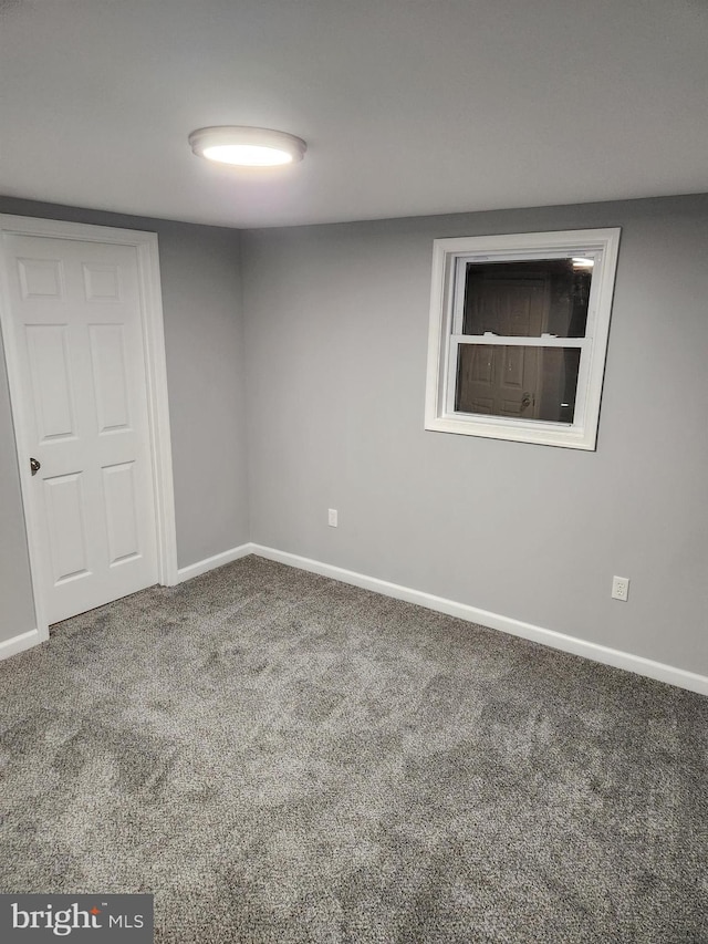 unfurnished room with carpet floors