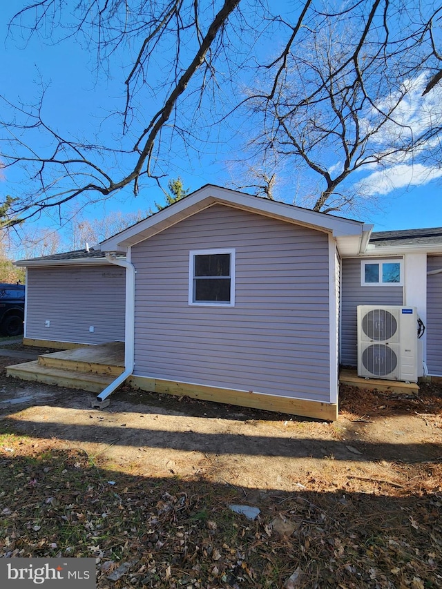 view of home's exterior with ac unit