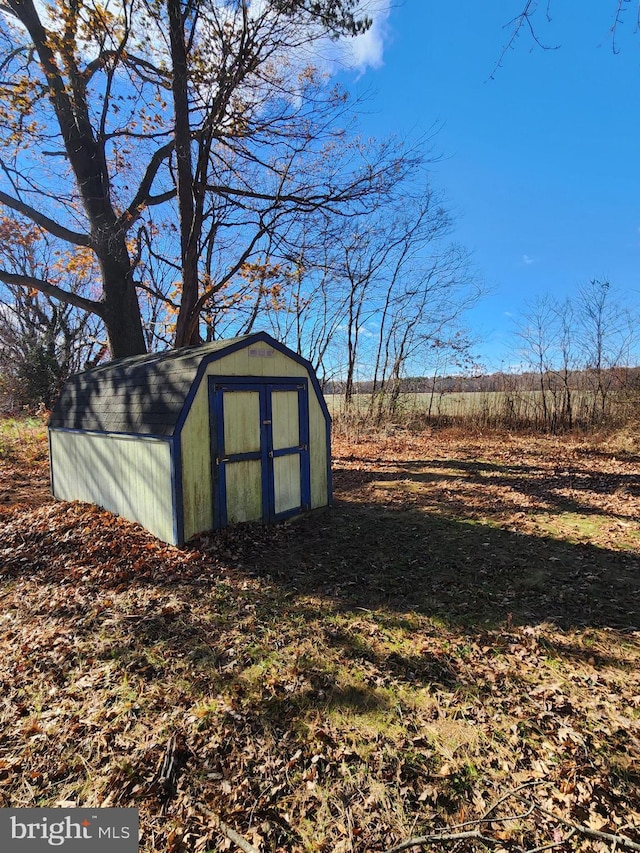 view of outdoor structure featuring a rural view