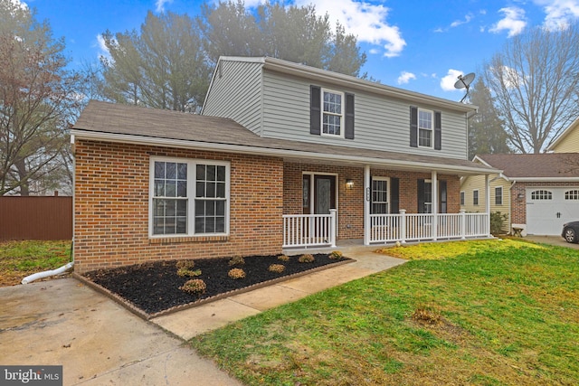 view of front property featuring a front lawn and a porch