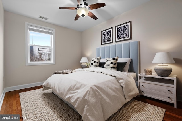 bedroom featuring ceiling fan and dark wood-type flooring