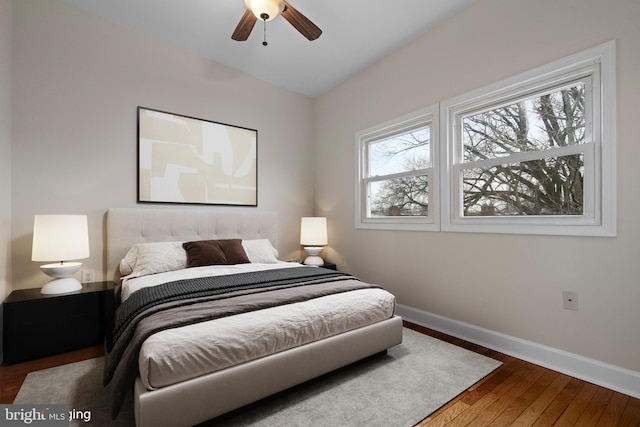 bedroom with ceiling fan and hardwood / wood-style floors