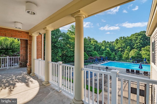 view of patio featuring a community pool