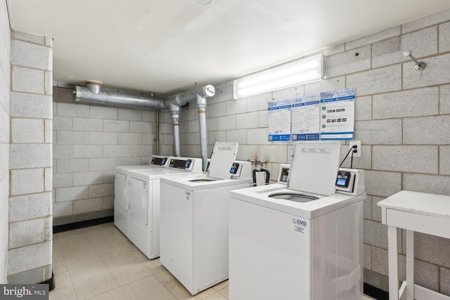 washroom with washing machine and dryer