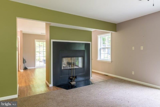 unfurnished living room featuring light hardwood / wood-style floors