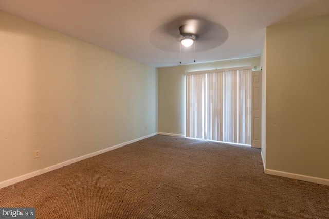 unfurnished room featuring carpet and ceiling fan