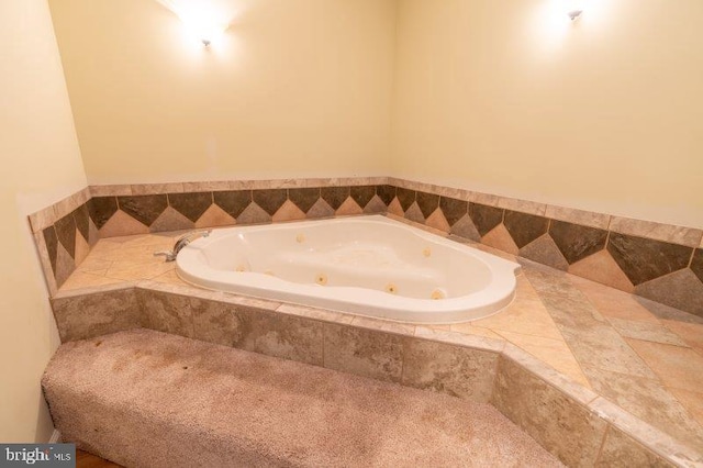 bathroom featuring a relaxing tiled tub