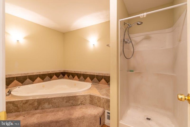 bathroom featuring plus walk in shower