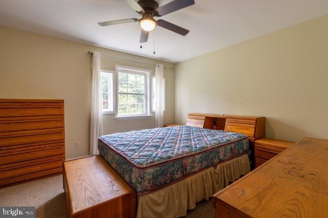 bedroom featuring hardwood / wood-style floors and ceiling fan