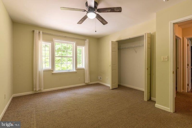 unfurnished bedroom featuring carpet flooring, a closet, and ceiling fan