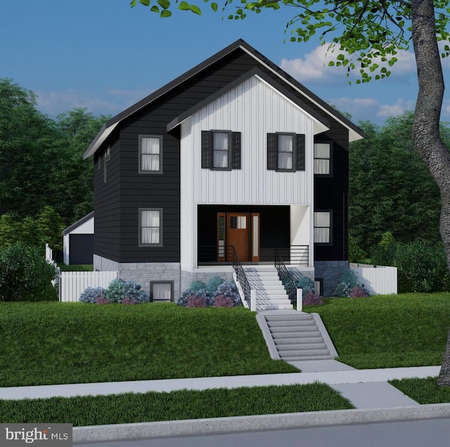 view of front facade featuring covered porch and a front lawn