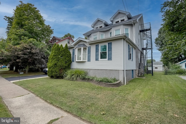 view of property exterior featuring a yard