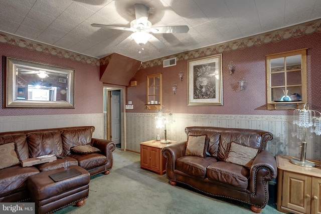 living room with light carpet and ceiling fan