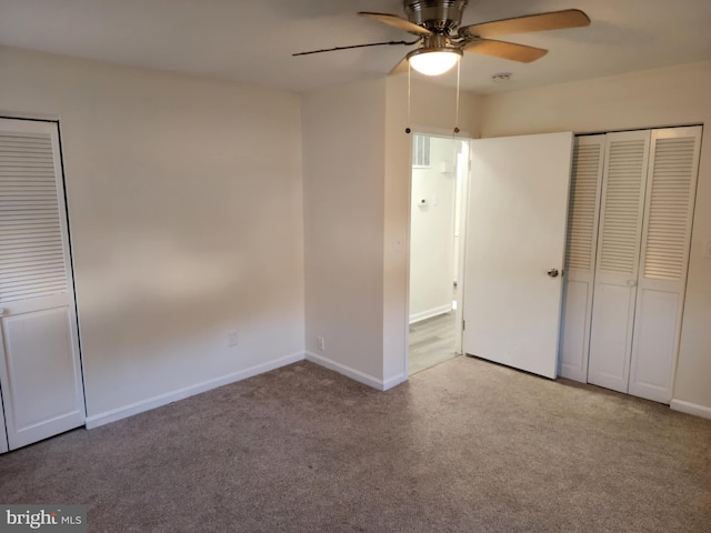 unfurnished bedroom featuring carpet floors, ceiling fan, and baseboards