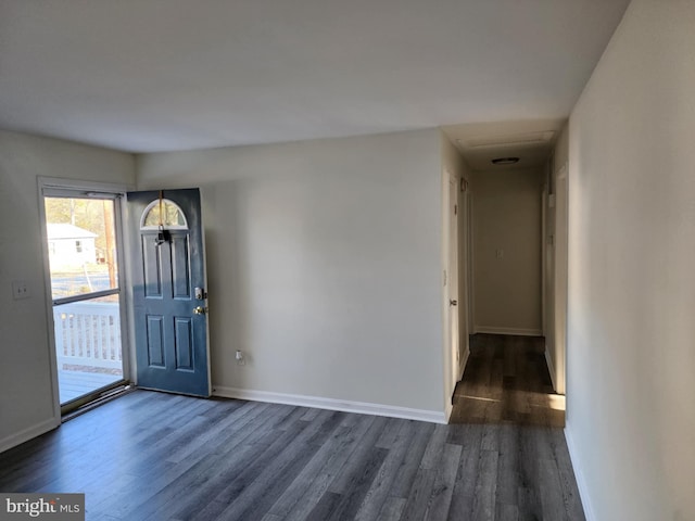 entryway with baseboards and dark wood-style flooring