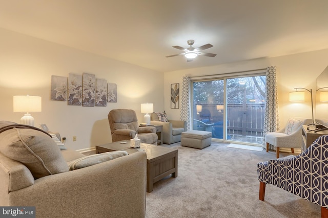 carpeted living room featuring ceiling fan