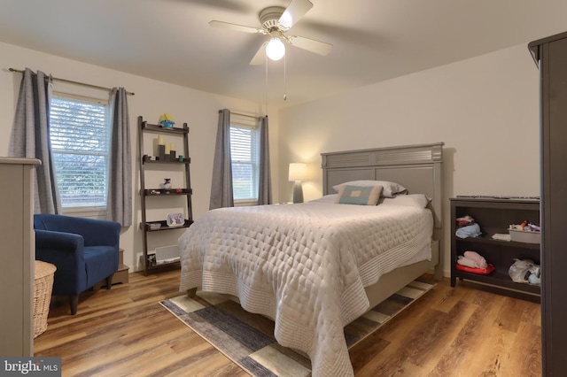 bedroom featuring hardwood / wood-style floors and ceiling fan